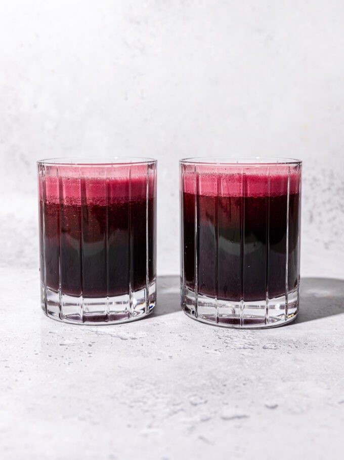 two glasses of red beet juice side by side